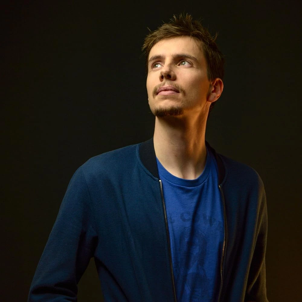 Portrait of John Dada in a blue jacket